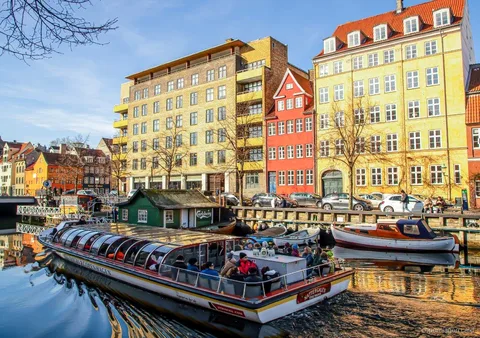 Canal boat tour included with the Copenhagen Bus and Boat Ticket passing Nyhavn